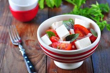 salad of tomatoes, feta cheese, onion and basil