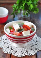 salad of tomatoes, feta cheese, onion and basil