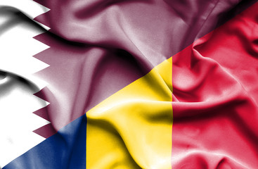 Waving flag of Chad and Qatar