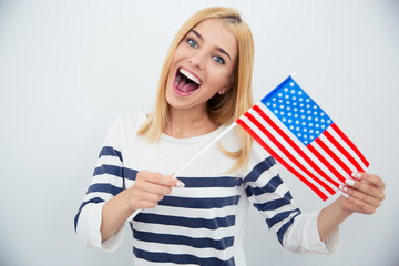Cheerful young girl holding USA flag