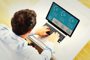 Fototapeta na wymiar Composite image of man using laptop