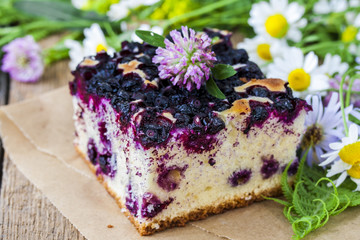 pie with blueberries on wooden table