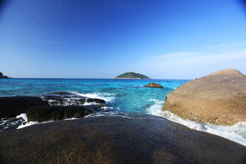 surf on a sandy beach paradise island