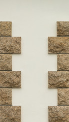 Hintergrund Ecksteine aus Granit mit weißer Wand