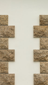Hintergrund Ecksteine aus Granit mit wei&szlig;er Wand