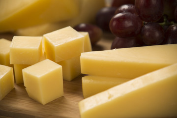 Different cheeses on a cutting board, delicious food