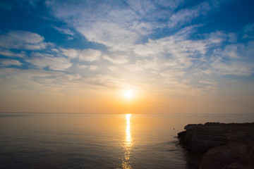 Rocky sea shore on the beautiful sunrise