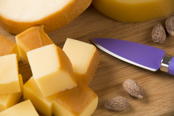 Different cheeses on a cutting board, delicious food