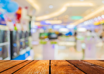 blur image of eletronic department store for background usage