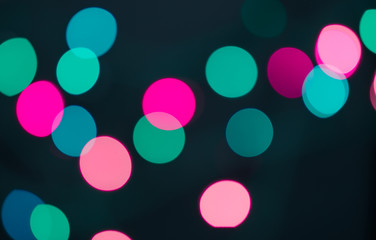 Abstract blurred background and theme: colorful bokeh blurred lights on a dark background
