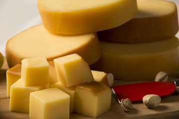 Different cheeses on a cutting board, delicious food