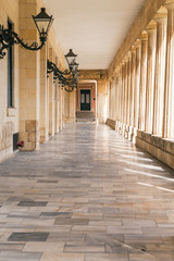 Colonnade with lanterns, Museum of Asian art in Kerkyra , Corfu island, Greece. Museum was built as palace 1824. Selective focus.