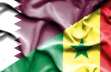 Waving flag of Senegal and Qatar