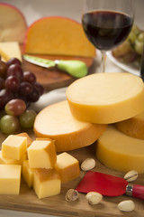 Different cheeses on a cutting board, delicious food