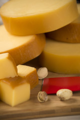 Different cheeses on a cutting board, delicious food
