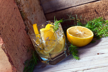 alcoholic drink with lemon and ice
