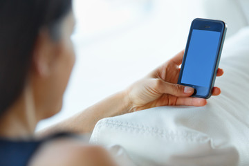 Business Woman Using Her Smartphone at The Office