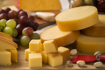 Different cheeses on a cutting board, delicious food