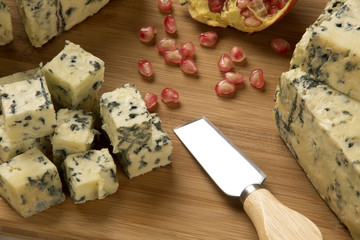 Different cheeses on a cutting board, delicious food