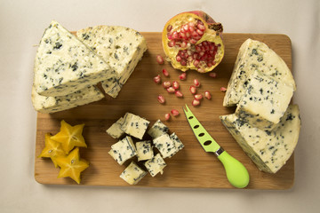 Different cheeses on a cutting board, delicious food