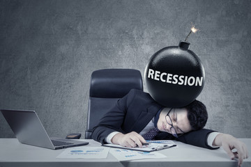 Worker with a bomb of financial recession