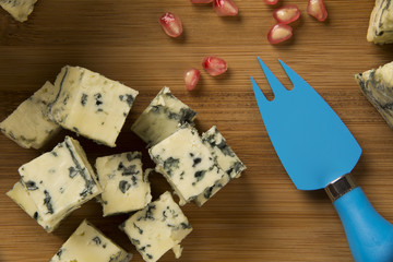 Different cheeses on a cutting board, delicious food