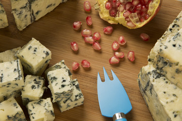 Different cheeses on a cutting board, delicious food