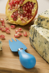 Different cheeses on a cutting board, delicious food