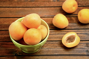 Green bowl with apricots