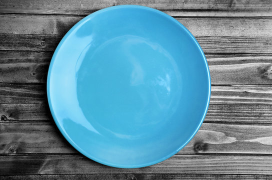 Empty blue plate on table