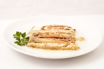 Dish of roasted mackerels.