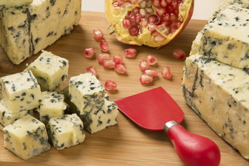 Different cheeses on a cutting board, delicious food
