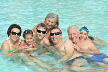 Family relax in  pool