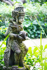 Fototapeta na wymiar Water bearer garden statue