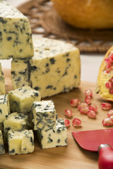 Different cheeses on a cutting board, delicious food