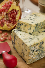 Different cheeses on a cutting board, delicious food