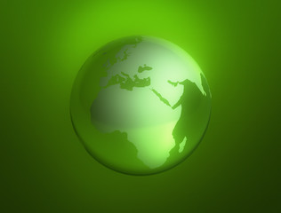 World glass globe on green background