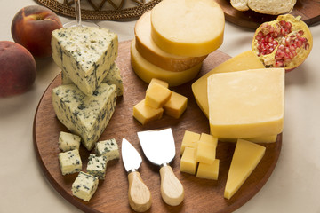 Different cheeses on a cutting board, delicious food