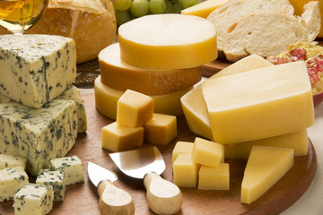 Different cheeses on a cutting board, delicious food