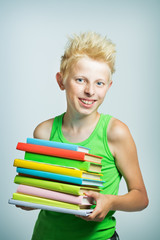boy with a stack of books