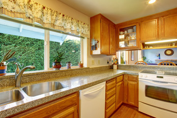 classic kitchen with hardwood floor and bar.