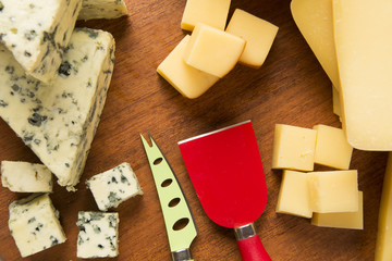 Different cheeses on a cutting board, delicious food