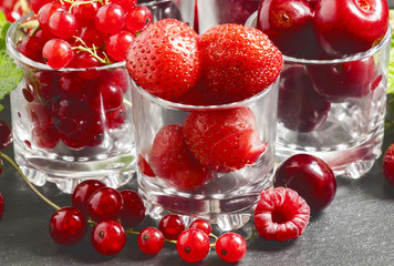 Assorted summer berries: raspberries, red currant, cherry, straw