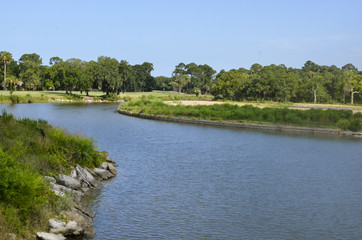 Inter-coastal shore line under blue cloudless sky
