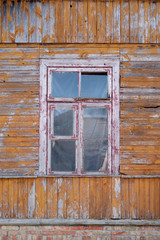 Old wooden house wall with window