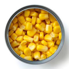 Open tin of sweetcorn isolated from above.
