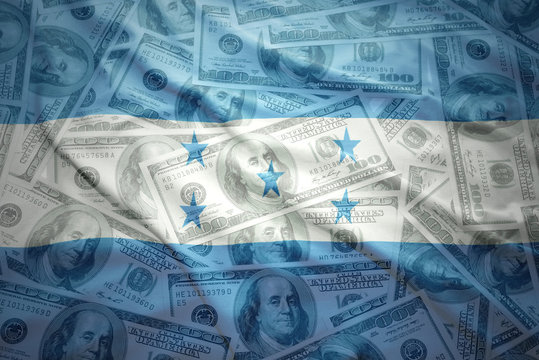 colorful waving honduran flag on a american dollar money background