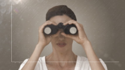 Businesswoman looking through binoculars at graph - Powered by Adobe