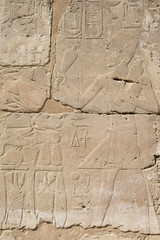 old egypt hieroglyphs carved on the stone