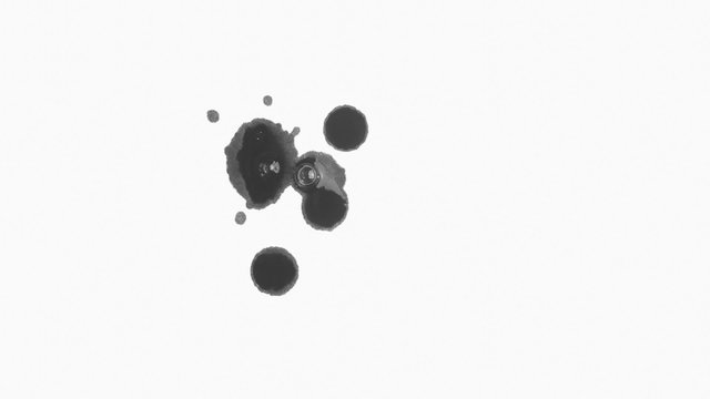 Black Ink Drips On A Clean Sheet